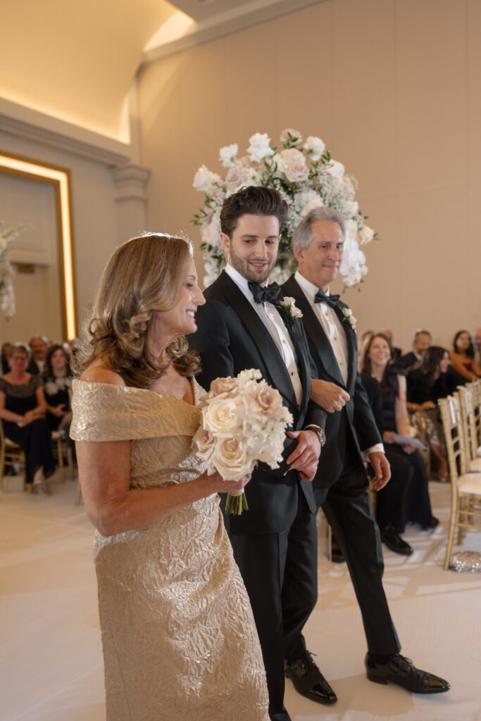 Wedding Ceremony Tips Groom walking down the aisle with his parents
