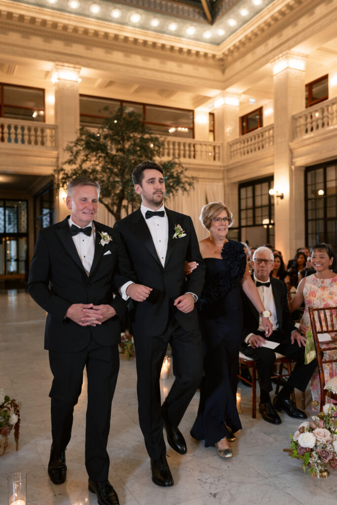 Groom walking down the aisle at The Exchange in Chicago